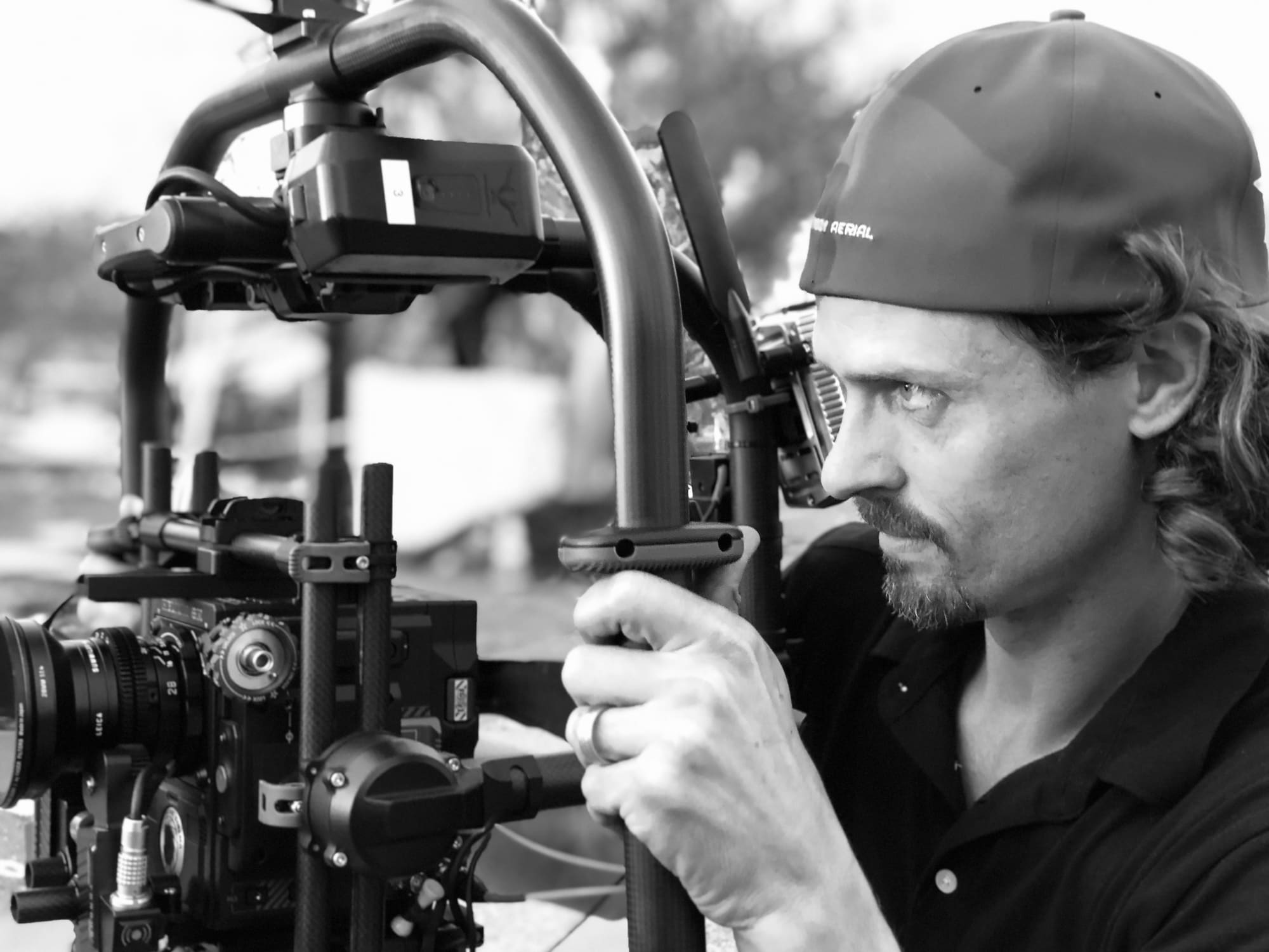 Drone Tech Aerial operator running a gimbal-stabilized RED cinema camera on set